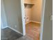 Practical laundry area with tile flooring, utility connections, and shelving for organized convenience at 31878 N Bandit Rd, San Tan Valley, AZ 85143