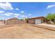 Expansive backyard featuring a block fence, potential RV parking, and convenient access to the garage at 4556 W Cholla St, Glendale, AZ 85304