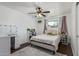 Bedroom with wood floors, white walls, and a desk with a vanity mirror at 4556 W Cholla St, Glendale, AZ 85304
