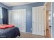 Cozy bedroom featuring a closet and a second door leading to other areas in the house at 4556 W Cholla St, Glendale, AZ 85304