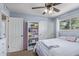 Charming bedroom featuring a light blue accent wall and a ceiling fan at 4556 W Cholla St, Glendale, AZ 85304
