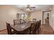 Inviting dining room features a dark wood table, seating for eight, and an archway to another room at 4556 W Cholla St, Glendale, AZ 85304