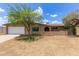 Charming single-story brick home with a well-maintained front yard and a convenient two-car garage at 4556 W Cholla St, Glendale, AZ 85304