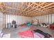 A messy unfinished garage with exposed studs at 4556 W Cholla St, Glendale, AZ 85304