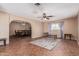 Open-concept living area with tiled flooring connecting the dining and entertaining spaces at 4556 W Cholla St, Glendale, AZ 85304