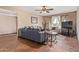 Cozy living room featuring tiled flooring, comfortable seating, and natural light from the windows at 4556 W Cholla St, Glendale, AZ 85304