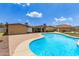 Backyard with a large pool and desert landscaping offers a retreat at 4556 W Cholla St, Glendale, AZ 85304