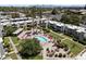Aerial view of community featuring pool, shuffleboard court, desert landscaping and mature trees at 4610 N 68Th St # 411, Scottsdale, AZ 85251