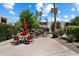 Outdoor community space with dining table, BBQ, desert landscape, and ample vegetation at 4610 N 68Th St # 411, Scottsdale, AZ 85251