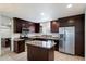 Well-appointed kitchen with stainless steel appliances, granite countertops, and center island at 4610 N 68Th St # 411, Scottsdale, AZ 85251