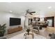 Open-concept living area with tile flooring, neutral paint, and stylish decor at 4610 N 68Th St # 411, Scottsdale, AZ 85251