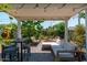 Backyard boasting a covered patio, comfortable seating, and lush plants, perfect for outdoor entertaining at 4629 N 9Th St, Phoenix, AZ 85014