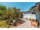 Quaint backyard with a paved patio area, bordered by mature trees and shrubs at 4629 N 9Th St, Phoenix, AZ 85014