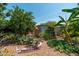 Backyard with bird bath, shed, banana tree, and thriving plant life, creating a natural and appealing outdoor retreat at 4629 N 9Th St, Phoenix, AZ 85014
