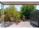 Landscaped backyard area featuring pavers, mature plants, and a storage shed at 4629 N 9Th St, Phoenix, AZ 85014