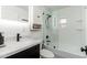 Updated bathroom featuring subway tile, black fixtures, and a modern vanity for a sleek, contemporary design at 4629 N 9Th St, Phoenix, AZ 85014