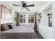 Cozy bedroom with a ceiling fan, bright window and natural lighting at 4629 N 9Th St, Phoenix, AZ 85014