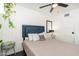 Inviting bedroom is bright, with ceiling fan, large window and simple design at 4629 N 9Th St, Phoenix, AZ 85014
