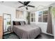 Comfortable bedroom includes a ceiling fan, bright window, and natural lighting at 4629 N 9Th St, Phoenix, AZ 85014