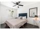 Comfortable bedroom features a ceiling fan, bright window and modern lighting at 4629 N 9Th St, Phoenix, AZ 85014