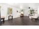 Well-lit living room with dark tile floors, lots of plants, and neutral décor at 4629 N 9Th St, Phoenix, AZ 85014