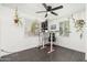 Bright home office with modern desk, contemporary ceiling fan, and tiled floors for a functional workspace at 4629 N 9Th St, Phoenix, AZ 85014