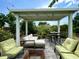 Outdoor patio with comfortable seating, a shaded pergola, and well-maintained landscaping at 4629 N 9Th St, Phoenix, AZ 85014