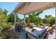 Charming covered patio with comfortable seating, perfect for outdoor relaxation and entertaining with lush landscaping at 4629 N 9Th St, Phoenix, AZ 85014