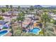 This aerial view of a charming home with pool amidst lush landscaping and beautiful mountain views at 5119 N 87Th St, Scottsdale, AZ 85250