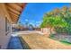 Spacious backyard with a shed, a basketball hoop, and a well-maintained lawn at 5119 N 87Th St, Scottsdale, AZ 85250