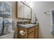 This bathroom features a vanity with mirror, toilet, and decorative towels creating a calming spa-like atmosphere at 5119 N 87Th St, Scottsdale, AZ 85250