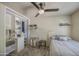 Modest bedroom featuring a ceiling fan, closet, tile flooring and a queen bed at 5119 N 87Th St, Scottsdale, AZ 85250
