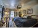 Comfortable bedroom featuring a ceiling fan, closet, sliding glass door and plush bedding at 5119 N 87Th St, Scottsdale, AZ 85250