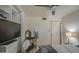 Neutral bedroom featuring a queen bed, ceiling fan, closet, carpet and tv at 5119 N 87Th St, Scottsdale, AZ 85250