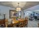Traditional dining room features a wood table, decorative lighting, and a large mirror that enhances the space at 5119 N 87Th St, Scottsdale, AZ 85250