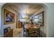 Elegant dining room featuring wood table, chandelier, and seamlessly connects to the living space at 5119 N 87Th St, Scottsdale, AZ 85250