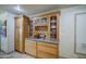 Detailed shot of kitchen cabinetry with integrated wine rack and ample storage space at 5119 N 87Th St, Scottsdale, AZ 85250