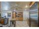 Well-equipped kitchen with stainless steel appliances, custom wood cabinetry, and tile flooring at 5119 N 87Th St, Scottsdale, AZ 85250