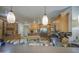 Open kitchen with bar seating, stainless steel appliances, and abundant wood cabinet storage at 5119 N 87Th St, Scottsdale, AZ 85250