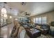 Comfortable living room featuring modern lighting, plush sofas, and a decorative ottoman at 5119 N 87Th St, Scottsdale, AZ 85250