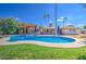 Resort-style backyard features a sparkling pool, a covered patio, and lush landscaping for ultimate relaxation at 5119 N 87Th St, Scottsdale, AZ 85250