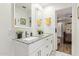 Bright bathroom featuring a double vanity with granite countertop, modern fixtures, and ample cabinet space at 5808 S 12Th Ln, Phoenix, AZ 85041
