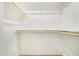 Spacious walk-in closet featuring ample shelving and hanging rods to maximize storage space at 5808 S 12Th Ln, Phoenix, AZ 85041