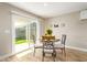 Cozy dining area with a view of the backyard and filled with natural light perfect for Gathering meals at 5808 S 12Th Ln, Phoenix, AZ 85041
