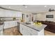 Modern kitchen with stainless appliances, granite countertops, and a central island for casual dining at 5808 S 12Th Ln, Phoenix, AZ 85041