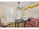 Office space featuring a sewing machine, chair, and wood-look flooring at 5808 S 12Th Ln, Phoenix, AZ 85041
