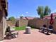 Cozy backyard featuring a brick patio, outdoor seating, and lush landscaping, perfect for entertaining at 6049 S Wilson Dr, Chandler, AZ 85249