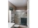 Well-maintained bathroom showcasing a shower with sliding glass doors and built-in shelving at 6049 S Wilson Dr, Chandler, AZ 85249
