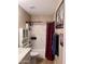 Neutral toned bathroom with a shower/tub combo and matching vanity at 6049 S Wilson Dr, Chandler, AZ 85249