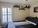 This bedroom features a large window with shutters and wall decor on shelves at 6049 S Wilson Dr, Chandler, AZ 85249